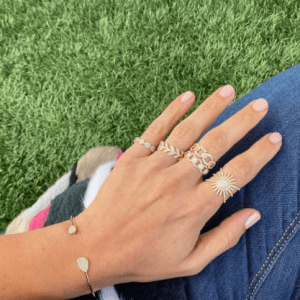 gold and diamond rings and bracelet on model