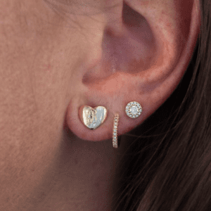 3 gold and diamond earrings worn on model