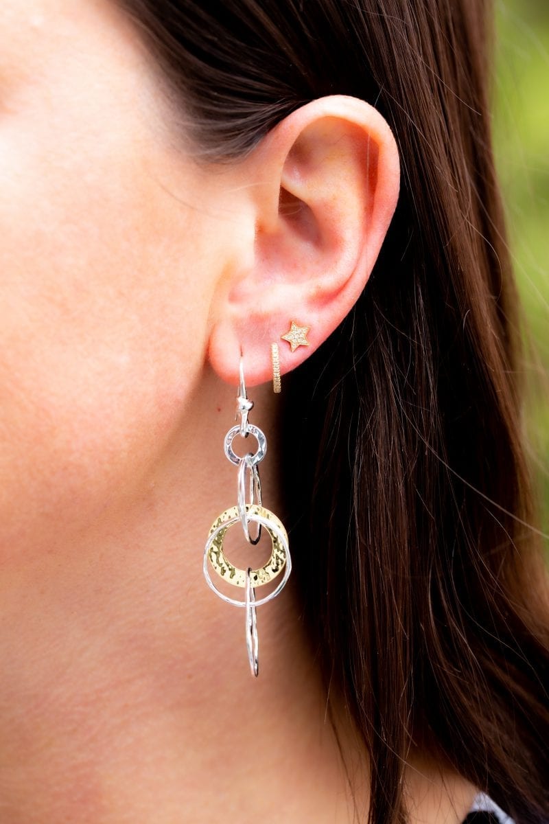 DEMIS07012_DEHOO14621_ISEAR06665 womans ear with Ippolita classico two toned jet set earring, tiny diamond hoop, and diamond star earring