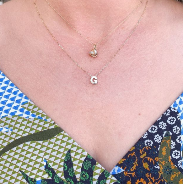 DPTNT02570 diamond love knot necklace KTFNM07469 heritage collection initial block necklace two gold necklaces on model