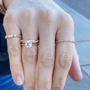 gold and diamond rings on model