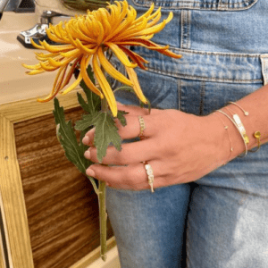 gold and silver bracelets and rings on model