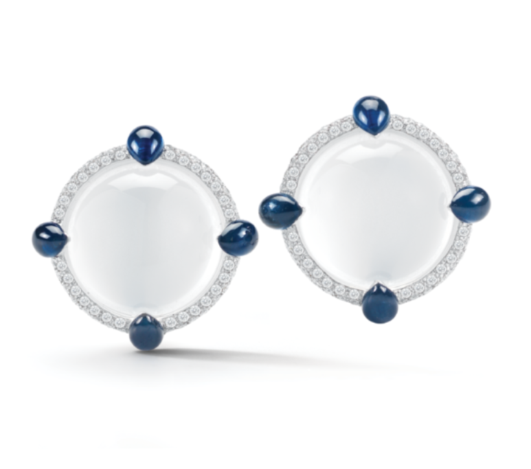 white quarts and sapphire earrings on white background