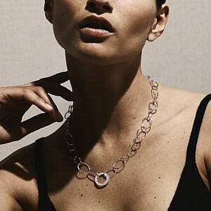 Model wearing Open Wavy Circle Chain Necklace in Sterling Silver with Diamonds