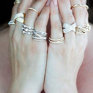 club collection gold and diamond rings on models hands