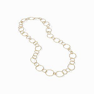 gold link necklace on white background laying down