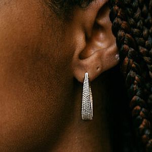 Ear with tapered diamond hoop earring