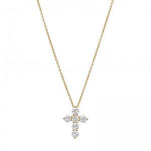 yellow gold diamond cross necklace on white background