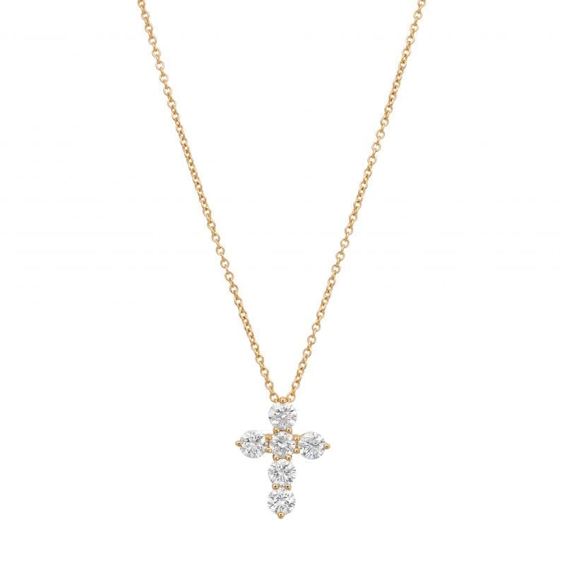 yellow gold diamond cross necklace on white background