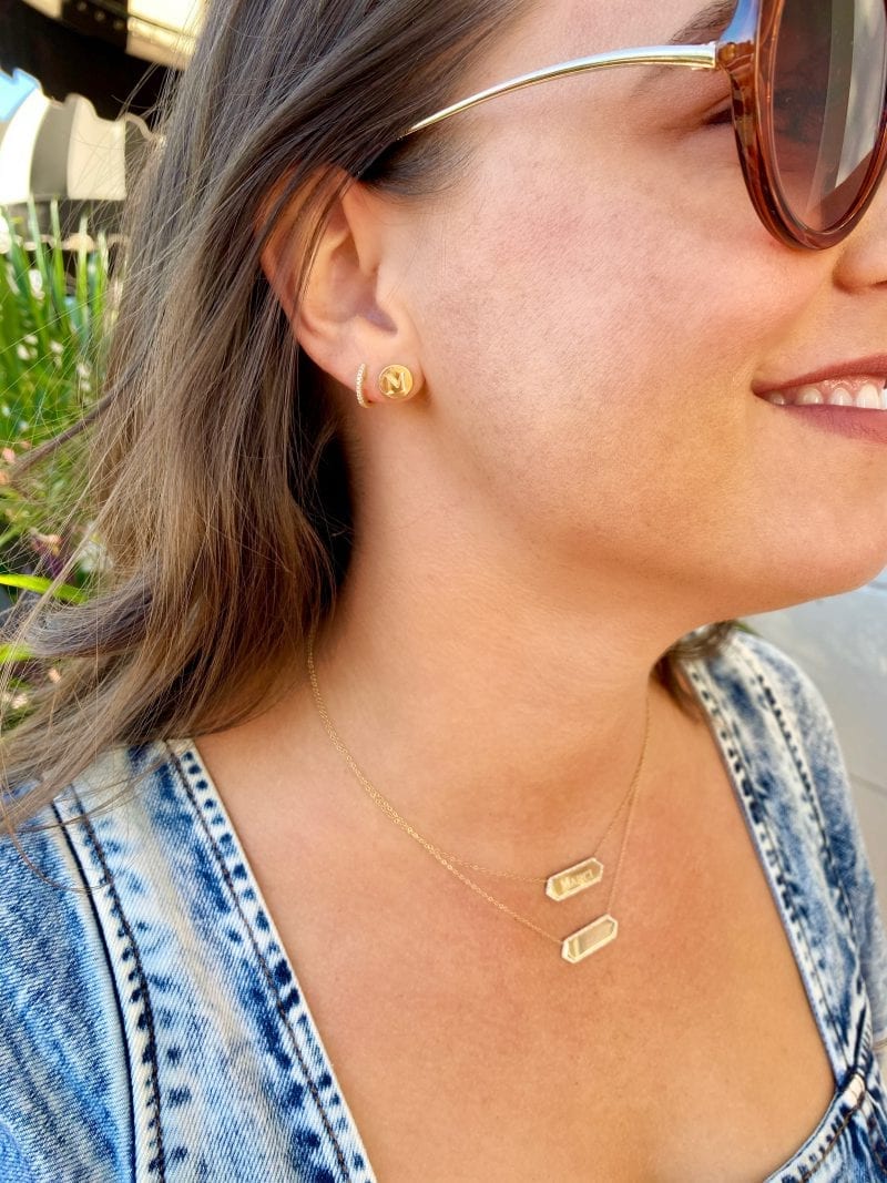 Heritage_collection_earrings_engraving_L-800x1067 model wearing collection jewelry