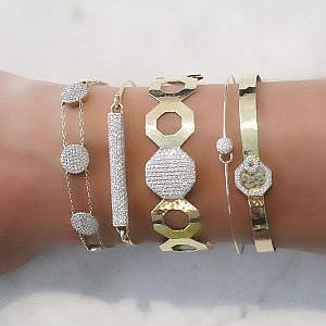 PHILLIPS HOUSE GOLD AND DIAMOND BRACELETS ON MODELS WRIST