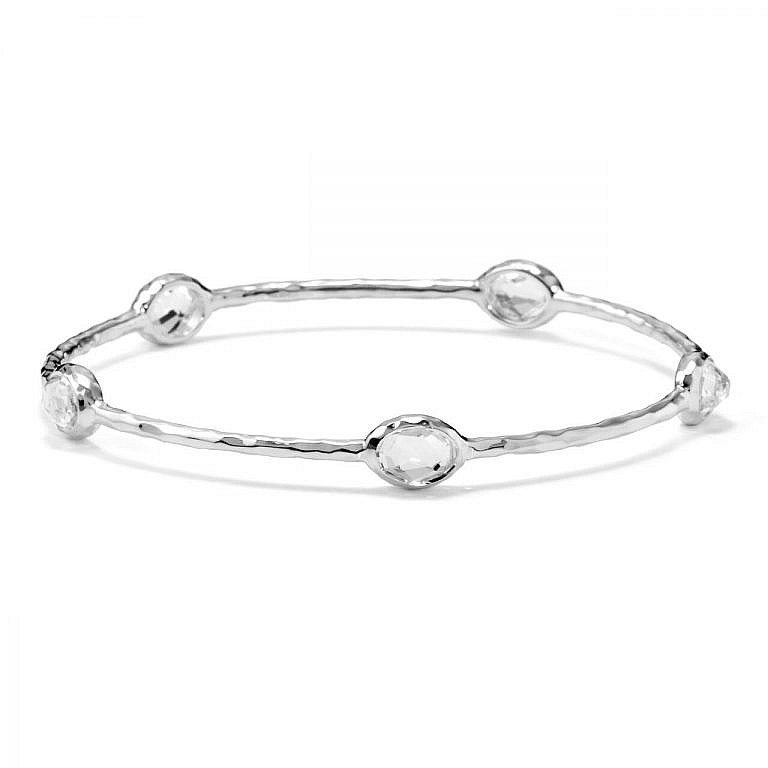 clear quarts silver bangle on white background