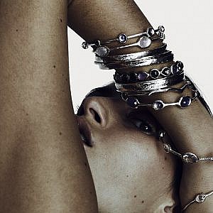 model wearing ippolita silver bangles