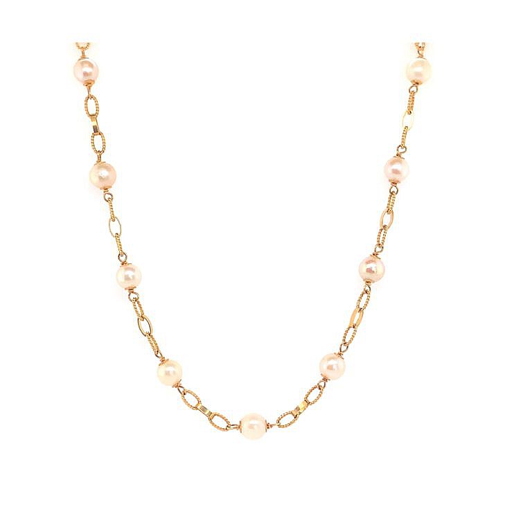 Estate gold link and pearl station necklace.