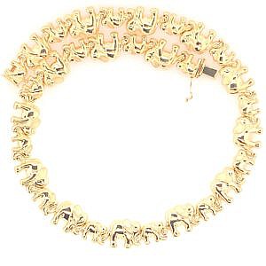 Close up of gold estate elephant necklace.