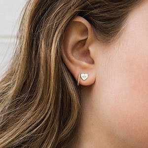 Diamond Starburst Heart Earrings on ear