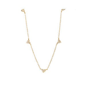 gold and diamond heart station necklace on white background