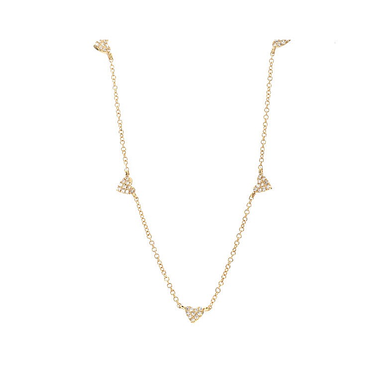 gold and diamond heart station necklace on white background
